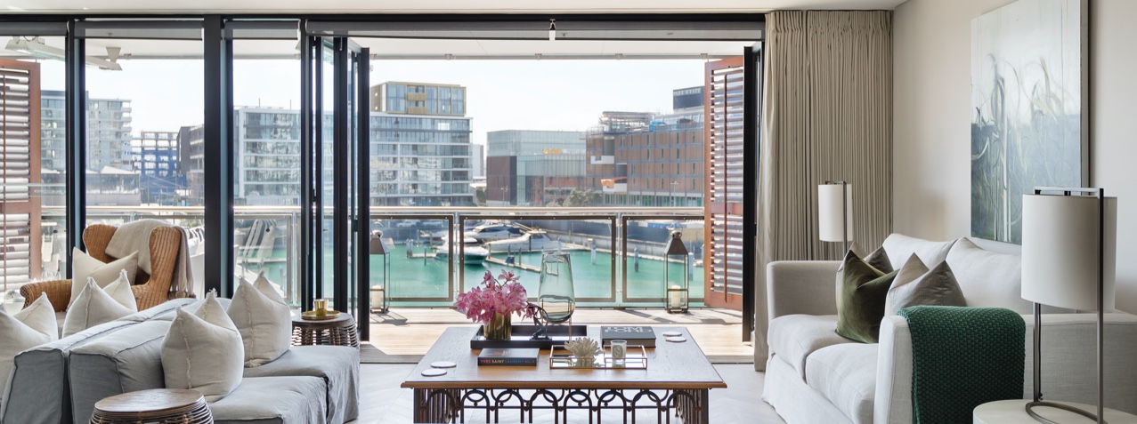 Living Room with indoor outdoor flow and Viaduct Harbour views | Point Residence Luxury Auckland Waterfront Accommodation